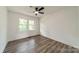 Neutral bedroom features wood-look floors and a bright window at 3608 Crestridge Dr, Charlotte, NC 28217