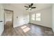 An airy bedroom boasts a ceiling fan, a closet, and natural light at 3608 Crestridge Dr, Charlotte, NC 28217