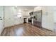 Updated kitchen features stainless appliances, white cabinets, and modern flooring at 3608 Crestridge Dr, Charlotte, NC 28217