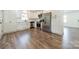 Modern kitchen with stainless steel appliances, white cabinets, and beautiful flooring at 3608 Crestridge Dr, Charlotte, NC 28217