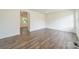 Bright, spacious living room with modern flooring and neutral walls at 3608 Crestridge Dr, Charlotte, NC 28217