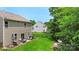 Large backyard with patio seating, lush lawn, and privacy fencing, perfect for outdoor living at 4006 Centerview Dr, Indian Trail, NC 28079