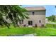 Relaxing backyard features a green lawn, patio seating area, and privacy fencing at 4006 Centerview Dr, Indian Trail, NC 28079