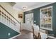 Inviting entryway featuring a large window, chair, white door with a wreath, and a staircase at 4006 Centerview Dr, Indian Trail, NC 28079