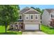 Charming two-story home featuring a brick and siding facade, well-manicured lawn and an attached two-car garage at 4006 Centerview Dr, Indian Trail, NC 28079