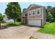 Inviting front view of a home featuring well-maintained landscaping and a spacious driveway leading to an attached garage at 4006 Centerview Dr, Indian Trail, NC 28079