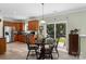 Eat-in kitchen with wood cabinets, stainless refrigerator, and sliding glass door to backyard at 4006 Centerview Dr, Indian Trail, NC 28079