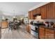 Open kitchen features stainless steel appliances, stone backsplash, and wood cabinets at 4006 Centerview Dr, Indian Trail, NC 28079