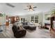 Open floor plan view of living room with fireplace, adjacent to kitchen, and large sectional couch at 4006 Centerview Dr, Indian Trail, NC 28079