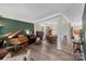Elegant living area featuring a piano, hardwood floors, neutral walls, and dining area at 4006 Centerview Dr, Indian Trail, NC 28079