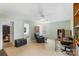 Bright living room featuring neutral carpet, comfortable seating, and a ceiling fan, ideal for relaxation and entertainment at 4006 Centerview Dr, Indian Trail, NC 28079