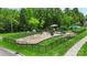 Playground enclosed by a black fence with swings, slides, and climbing structures, providing a safe recreational area at 4006 Centerview Dr, Indian Trail, NC 28079