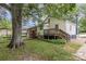 Backyard featuring a deck, shed and large shade tree at 403 Weaver St, Cherryville, NC 28021