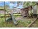 Backyard play set featuring a slide, swings and playhouse at 403 Weaver St, Cherryville, NC 28021