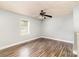 Neutral bedroom featuring a ceiling fan, updated flooring, and plenty of natural light at 403 Weaver St, Cherryville, NC 28021
