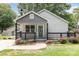 Charming home featuring a cozy porch, decorative railings, and well-maintained landscaping at 403 Weaver St, Cherryville, NC 28021