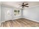 Inviting living room features a decorative front door, ample natural light, and wood-look flooring at 403 Weaver St, Cherryville, NC 28021
