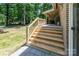 The backyard features a grill on the brick patio, wooden stairs, a swing, and a hammock at 411 Saint Andrews Rd, Statesville, NC 28625