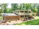 Charming two-story home with brick accents, a landscaped yard, and a welcoming front porch at 411 Saint Andrews Rd, Statesville, NC 28625