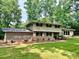 Inviting two-story home with well-maintained lawn and brick accents at 411 Saint Andrews Rd, Statesville, NC 28625