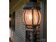 Close-up of an exterior light fixture highlighting architectural detail on the home's facade at 411 Saint Andrews Rd, Statesville, NC 28625