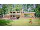 Charming two-story home with brick accents, a landscaped yard, and a welcoming front porch at 411 Saint Andrews Rd, Statesville, NC 28625