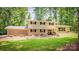Charming two-story home with brick accents, a landscaped yard, and a welcoming front porch at 411 Saint Andrews Rd, Statesville, NC 28625