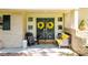 Inviting front doors adorned with yellow wreaths, complemented by stylish seating, creates a warm welcome at 411 Saint Andrews Rd, Statesville, NC 28625