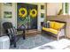 Inviting front doors adorned with yellow wreaths, complemented by stylish seating, creates a warm welcome at 411 Saint Andrews Rd, Statesville, NC 28625