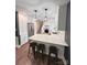 Modern kitchen with stainless steel appliances, white cabinets, and marble countertops at 411 Saint Andrews Rd, Statesville, NC 28625