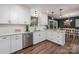 A bright, updated kitchen featuring marble countertops, subway tile backsplash and stainless steel appliances at 411 Saint Andrews Rd, Statesville, NC 28625