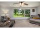 Sunlit living room with an expansive window offering picturesque backyard views at 411 Saint Andrews Rd, Statesville, NC 28625