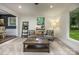 Inviting living room featuring cozy seating, stylish decor, and ample natural light at 411 Saint Andrews Rd, Statesville, NC 28625