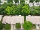 High angle aerial showcasing community layout with tree-lined streets and manicured lawns; a serene living environment at 4510 Glenlea Commons Dr, Charlotte, NC 28216