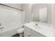 Clean, bright bathroom with white fixtures including a tub, toilet, and vanity at 4510 Glenlea Commons Dr, Charlotte, NC 28216