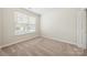 Cozy bedroom with plush carpet, a large window letting in natural light at 4510 Glenlea Commons Dr, Charlotte, NC 28216