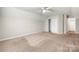 Neutral-toned bedroom featuring a ceiling fan, carpeted floor, and a closet at 4510 Glenlea Commons Dr, Charlotte, NC 28216