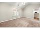 Neutral bedroom featuring neutral carpet and plenty of natural light at 4510 Glenlea Commons Dr, Charlotte, NC 28216