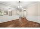 Open-concept dining area with stylish flooring and elegant trim work, ideal for Gathering gatherings at 4510 Glenlea Commons Dr, Charlotte, NC 28216