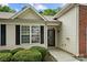 A close up of the front entrance with clean design and a well maintained lawn at 4510 Glenlea Commons Dr, Charlotte, NC 28216