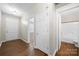 Bright entry featuring wood floors, and doors leading to other rooms including a bathroom at 4510 Glenlea Commons Dr, Charlotte, NC 28216
