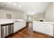 Charming kitchen flows into a sun-filled living room with a fireplace at 4510 Glenlea Commons Dr, Charlotte, NC 28216