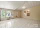 Tiled sunroom featuring sliding glass doors and plenty of sunlight at 4510 Glenlea Commons Dr, Charlotte, NC 28216