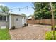 A backyard featuring a brick patio, a wooden fence, string lights, and the back exterior of a home at 5008 Unaka Ave, Charlotte, NC 28205