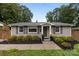 Charming brick home with well-maintained landscaping and a welcoming entrance with dark shutters at 5008 Unaka Ave, Charlotte, NC 28205