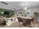 Cozy living and dining space with modern decor, including plush seating and a stylish dining set at 5008 Unaka Ave, Charlotte, NC 28205