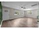 Bright living room features hardwood floors, large windows, and a neutral color palette at 5008 Unaka Ave, Charlotte, NC 28205
