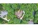 Aerial view of an estate surrounded by lush green trees showing the home's driveway and large lot at 517 Kingsdown Ct, Waxhaw, NC 28173