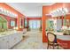 Colorful bathroom boasts dual vanities, a soaking tub, and a separate makeup area at 517 Kingsdown Ct, Waxhaw, NC 28173
