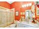 Elegant bathroom featuring a shower-tub combination, a decorative mirror, and a stylish vanity sink at 517 Kingsdown Ct, Waxhaw, NC 28173